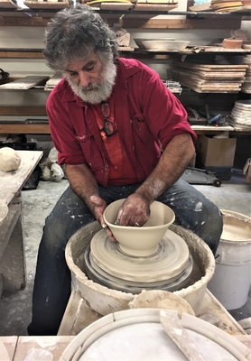 Matthew Tell molding clay into a bowl. His studio will be open for tours and demonstrations this weekend.
