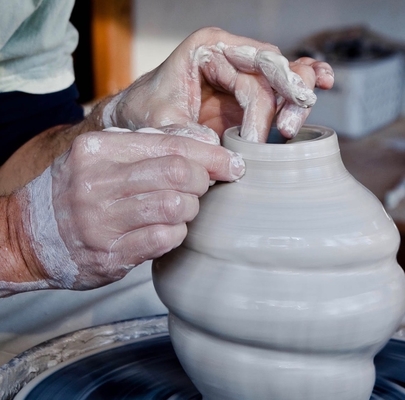 Walter Slowinski throwing a vase.