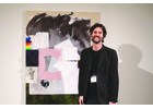 Artist Edward Holland in front of one of his paintings. Holland’s works bring to life the full potential of collage paintings as an aesthetic.